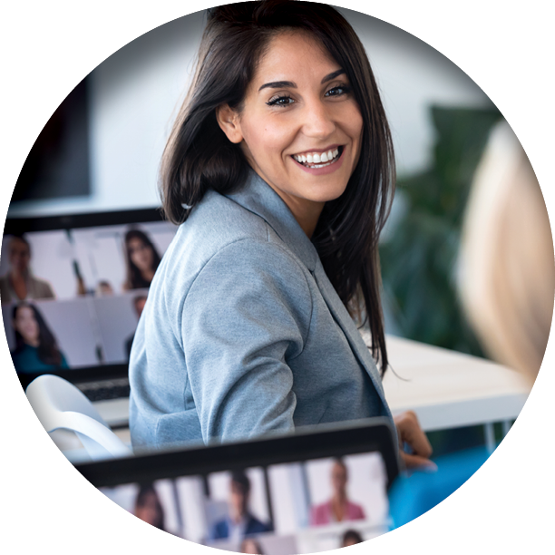 smiling business women on video meeting speaking with colleague